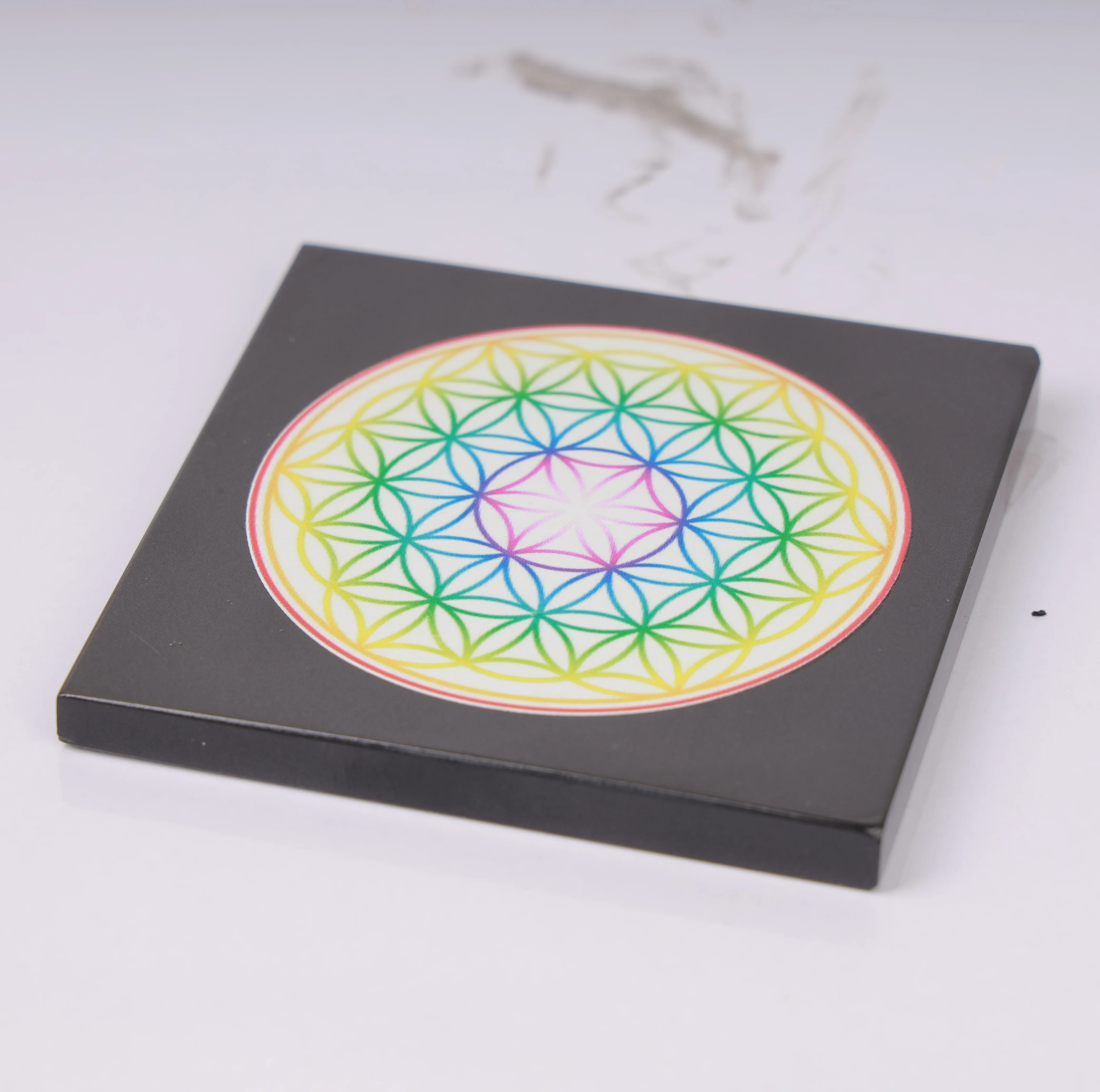 The flower of life sacred geometry in rainbow colors art black agate board